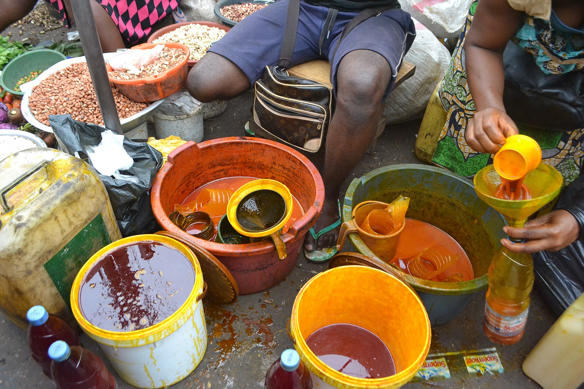 Red palm oil for sale in a Nigerian market